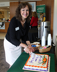 Dr. Duran cuts cake