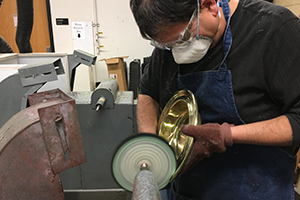 Buffing brass plate