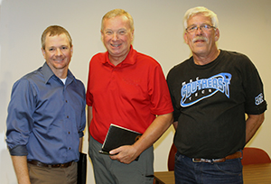 Gene Pelowski (Red Shirt, Center)