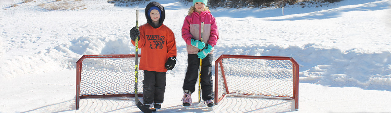 Kids play hockey on neighborhood rink