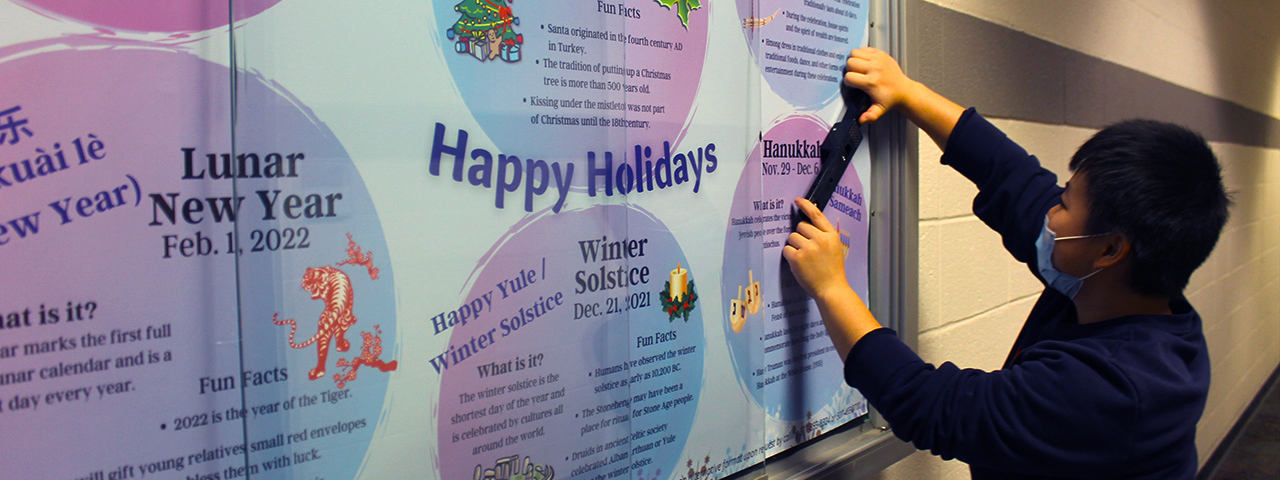 Pa Nhia Xiong and holiday poster