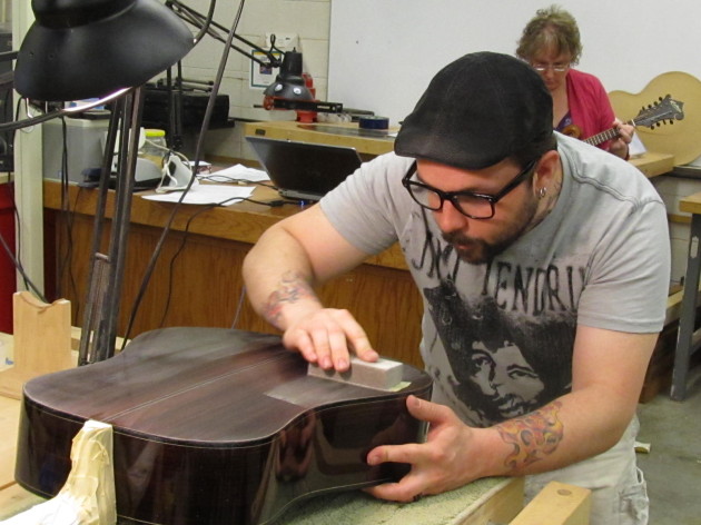 Student working on guitar