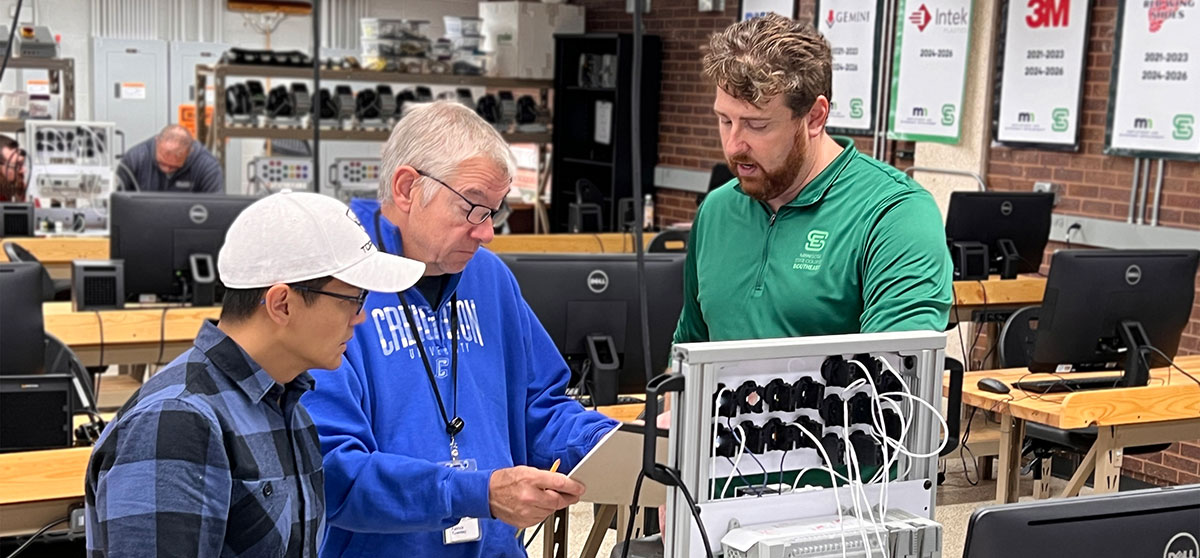 Students working with mechatronic instructor Chris Schwertel