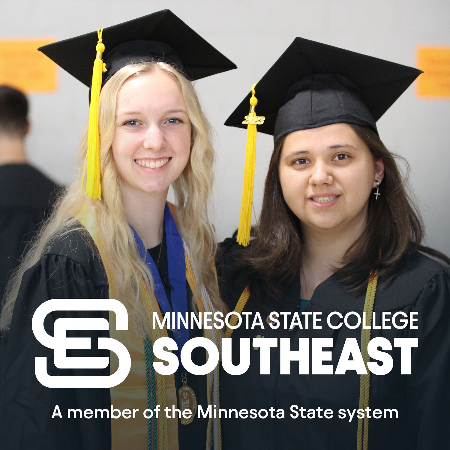 2 graduating students with logo- Minnesota State College Southeast, A member of the Minnesota State system