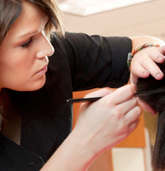 Cosmetologist working on hair