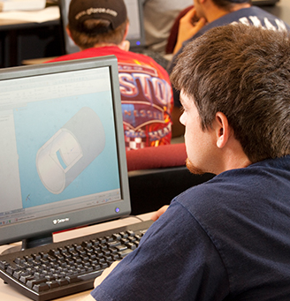 Student looking at a 3D rendering on a computer screen