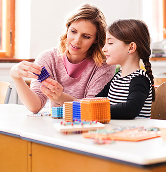 Teacher working with building blocks with a child