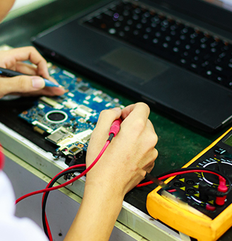 Hands working with a multi-meter: photo by Quang Nguyen Vinh from Pexels