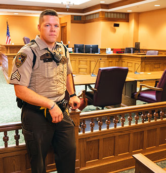 Officer Standing in Court Room