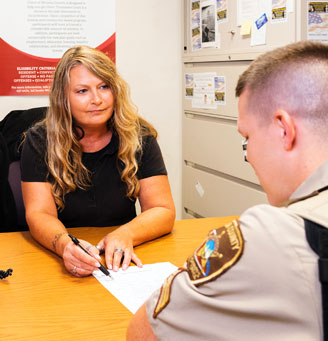 Officer talking with clerk