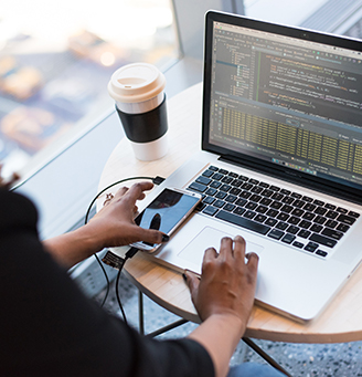 Woman coding on a laptop