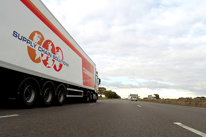 Semi truck on the highway - leaving