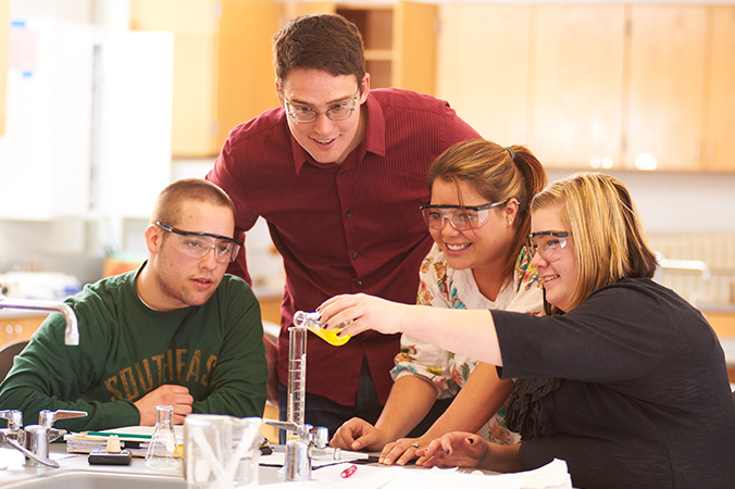 Instructor and students in chemestry lab