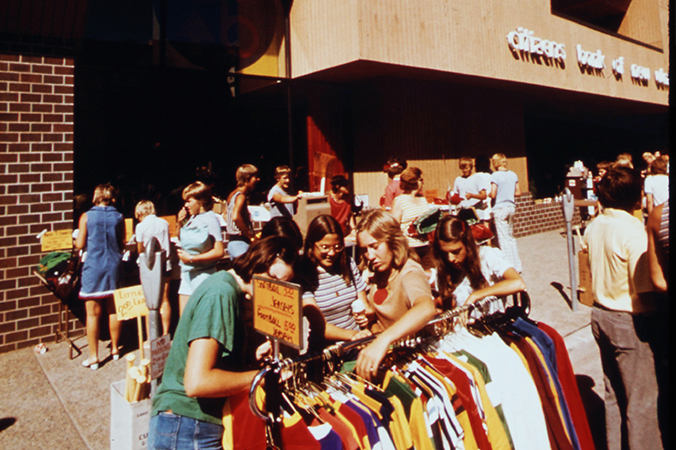 Teenagers in New Ulm looking at Crazy Days sales in 1974