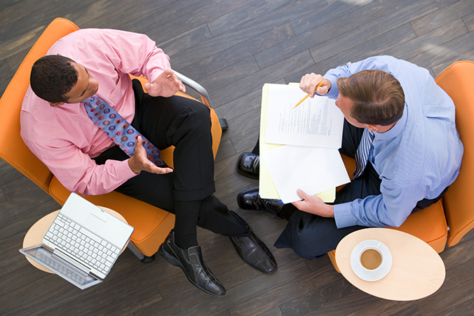 Two businessmen talking - seen from above